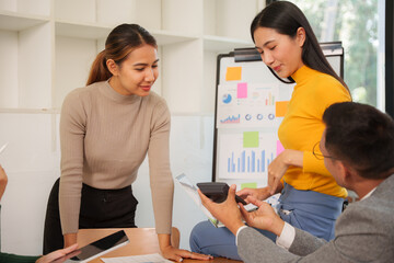 Group of Asian business people working together in an office