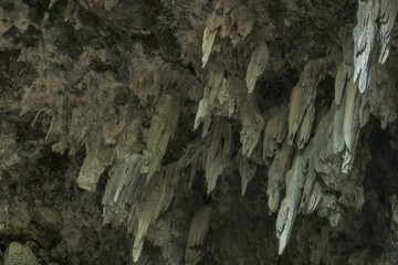 Natural patterns, stalactites and geological formations in the caves of the limestone karst mountains