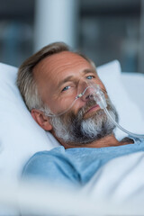 Adult patient man wearing ventilation tube for oxygen while laying on the bed at hospital, Medical service for surgery recovery, wellness and healing