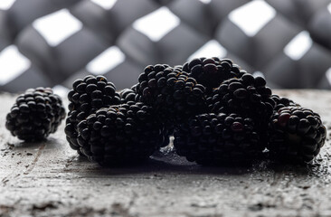 Back-Lit Blackberry Cluster Silhouette on Rustic Wood