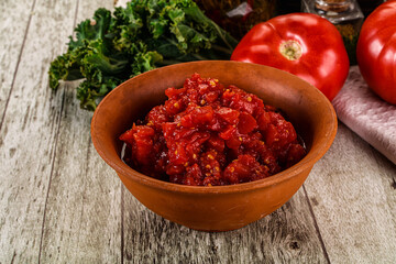 Diced ripe tomato with sauce