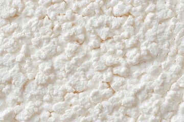 Fototapeta premium Close-up Texture of White Cottage Cheese Curds, displaying its soft, lumpy, and slightly moist appearance