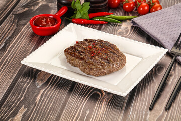Grilled beef burger cutlet with sauce