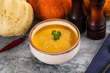 Vegan pumpkin cream soup served sesam