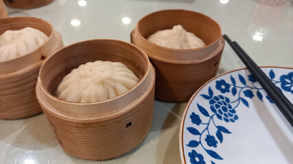 dumplings in wooden pots.
