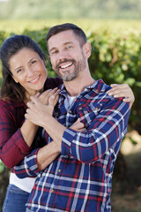 a happy couple in vineyard