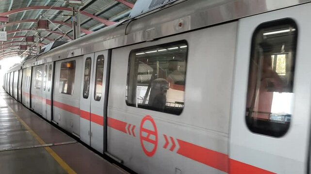 New Delhi, India, August 12 2024 - Delhi Metro train arriving at Jhandewalan metro station in New Delhi, India, Asia, Public Metro departing from Jhandewalan station