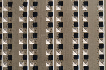 Perfect geometry of shadows and umbrellas on a deserted beach seen from above