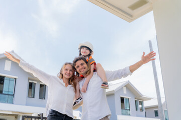 A little female architect on her father's shoulders and supported by her mother, symbolizing the...