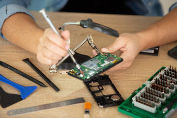 computer technician installs cooling system of computer
