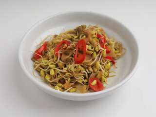 Stir fry mung beans sprout with garlic and chili on white background