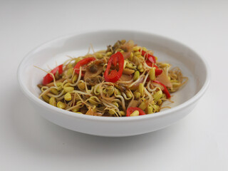 Stir fry mung beans sprout with garlic and chili on white background