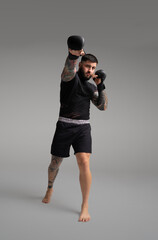 Mma fighter throwing a punch during training