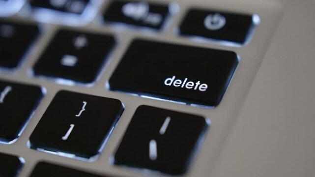 close up finger click delete button. Concept of digital and delete from storage.