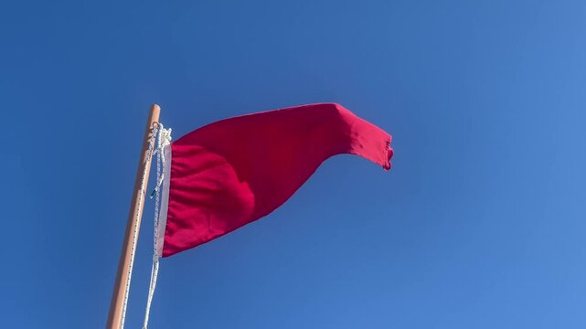 Red flag at a beach. Reports danger to bathing due to adverse weather or absence of lifeguard service. Danger to bathing
