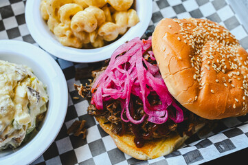 Close-Up of BBQ Pulled Pork sandwich With Sides