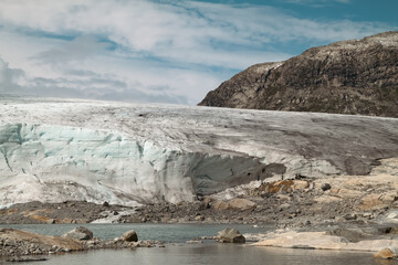 Wide view of Austdalsbreen Glacier on clear day in summer