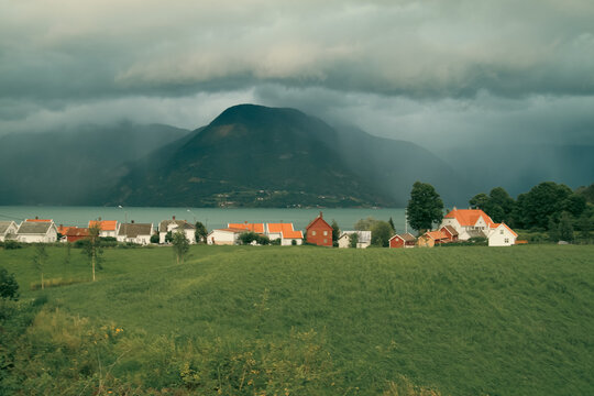 Small coastal nordic town in summer during rain storm