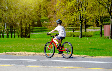 Cyclist ride on the bike path in the city Park
