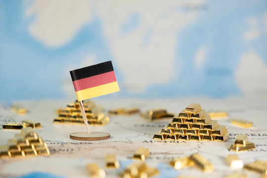 German flag prominently on a global map, surrounded by shining gold bars, symbolizing nation's economic power, wealth, and strategic investment