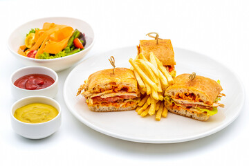 Healthy chicken sandwich served on a white porcelain plate with french fries and sauces