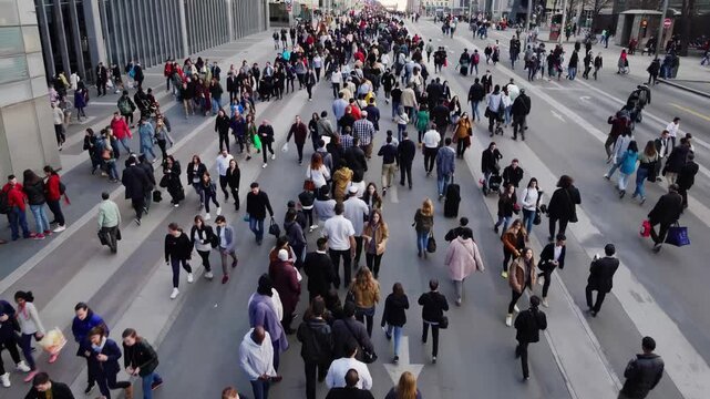 Increasing crowd density walking on a wide city street