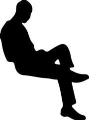 Silhouette of a man leaning against a wall