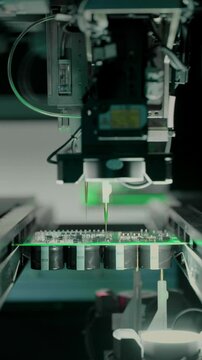 Close-up: installing electronic components. Printed circuit board moves with SMD. Automatic welding, solder machine. Production technology. Diagnose test chips and processors. Manufacture of High-tech