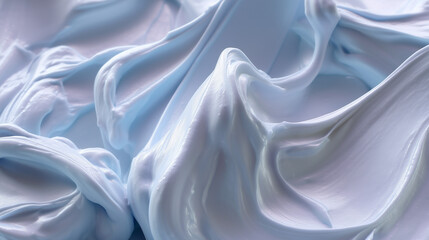 Obraz premium Closeup of smooth whipped blue frosting or creamy dessert texture. Wallpaper background texture