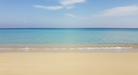 Serene Beach Scene Calm Ocean Waves on Sandy Shore under a Blue Sky