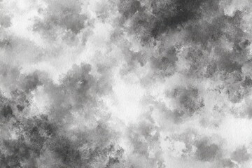 Abstract black and white watercolor texture with cloudy, textured patterns creating a dramatic and artistic background.