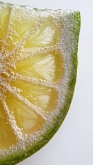 Fresh Lime Wedge with Bubbles on White Background