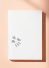 White book cover mockup layout design with shadows for branding, on peach background. book mockup. 