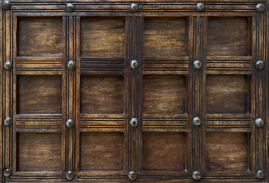 Exquisite Vintage Wooden Door with Rich Textures and Metallic Accents