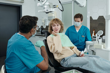Dentist and Patient Discussing Further Plans for Treatment
