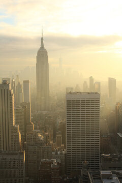 Foggy sunrise view over Manhattan skyline with Empire State Building