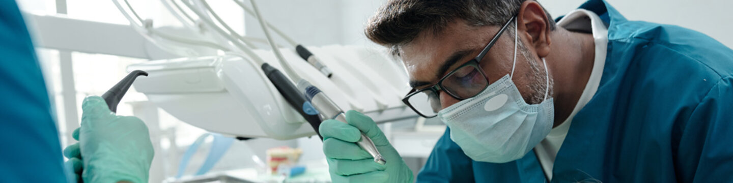 Young Woman Having Surgery in Modern Dental Clinic