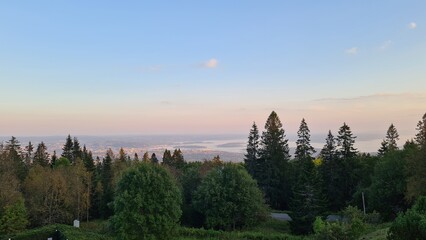 a  breathtaking view where nature and city coexist in harmony . soft light, fresh air, and the grandeur of the environment create a serene and inspiring atmosfere 