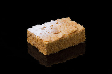  Flaky Napoleon Pastry Slice with Powdered Sugar on Black Background