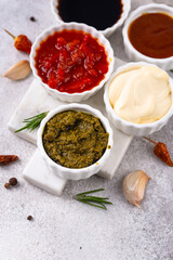 Set of different sauces. Ketchup, mustard, pesto