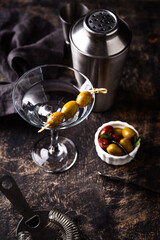Traditional martini cocktail with olives and