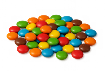 Colorful chocolate candy coated gems forming a pile on transparent background