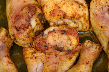 Baked chicken drumsticks in a home oven until golden brown