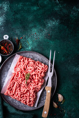 Raw minced meat on dark background
