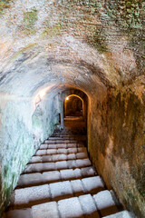 Fototapeta premium Ancient Stone Tunnel and Staircase within Santa Maria da Feira Castle, Portugal