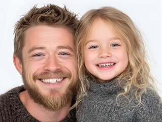 A happy father and his adorable young daughter smile warmly for a cheerful family portrait against a bright white background.