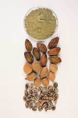 Ayurvedic herb triphala amla baheda harada on white background