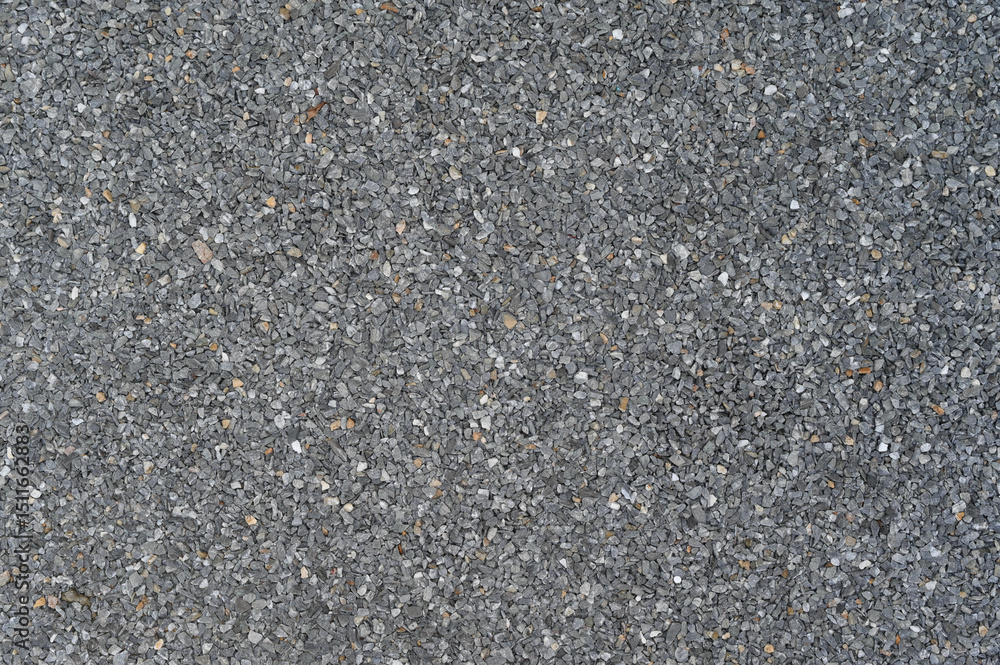 Poster Granular dark grey abrasive texture forms detailed close up surface background. Uniform rough pattern material appears across full frame ideal for graphic design