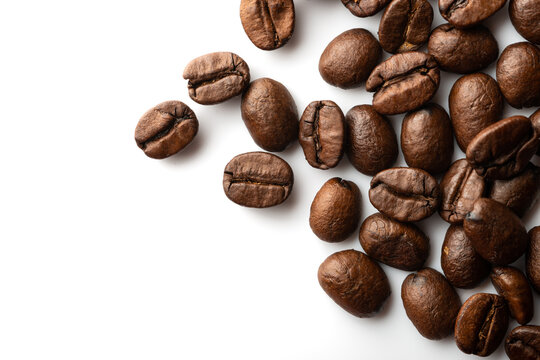 Coffee beans macro isolated on white background