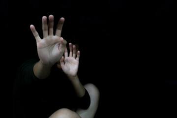 Fearful Stop Hands Raised in Darkness Against Abuse and Violence.